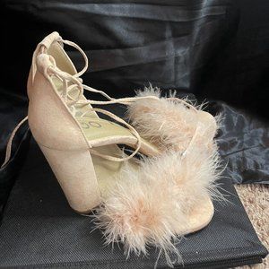furry beige sandal that tie around the ankle
